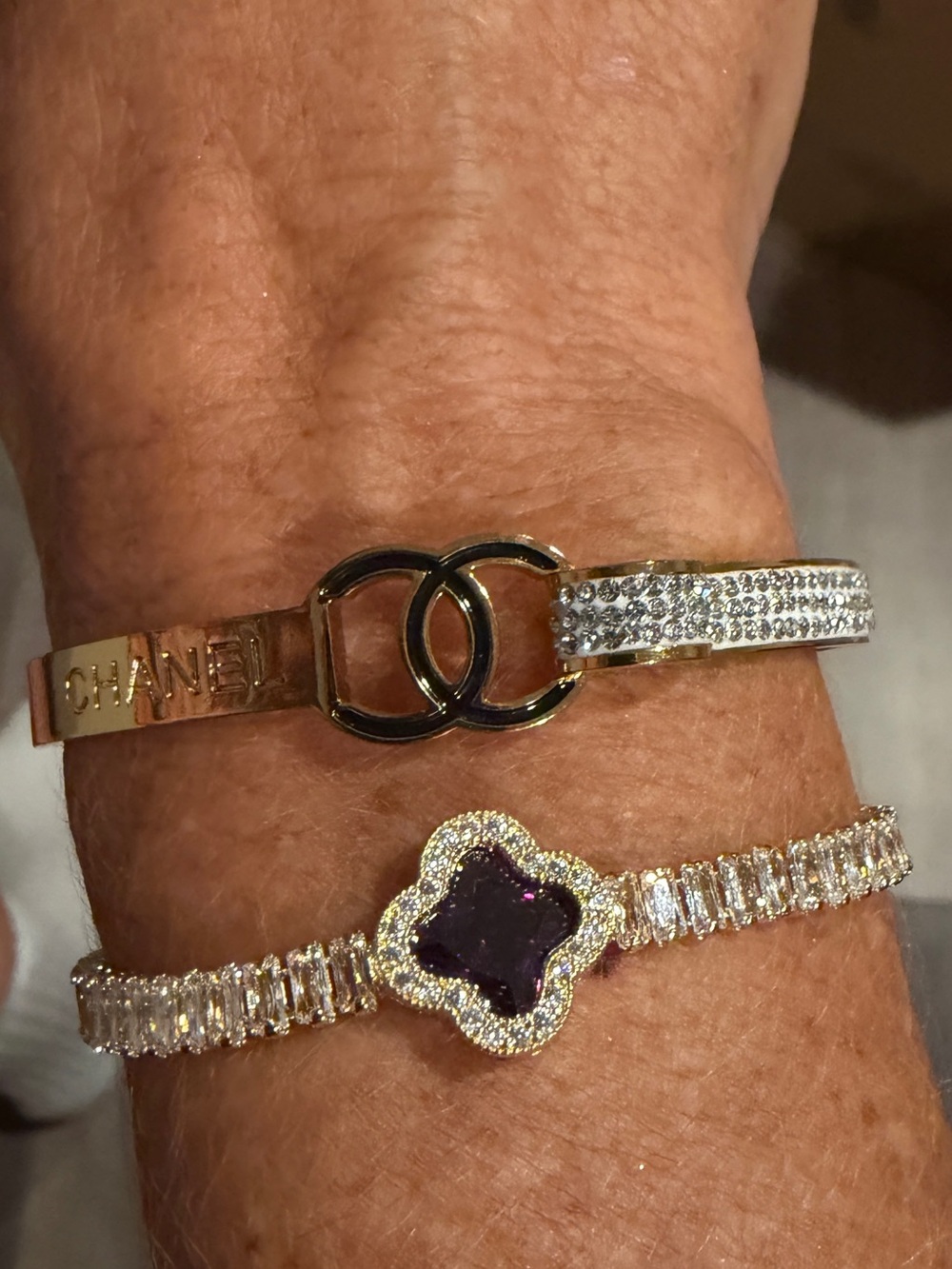 Gold-Tone Double C Bracelet with Clear Crystal Accents & Purple Clover